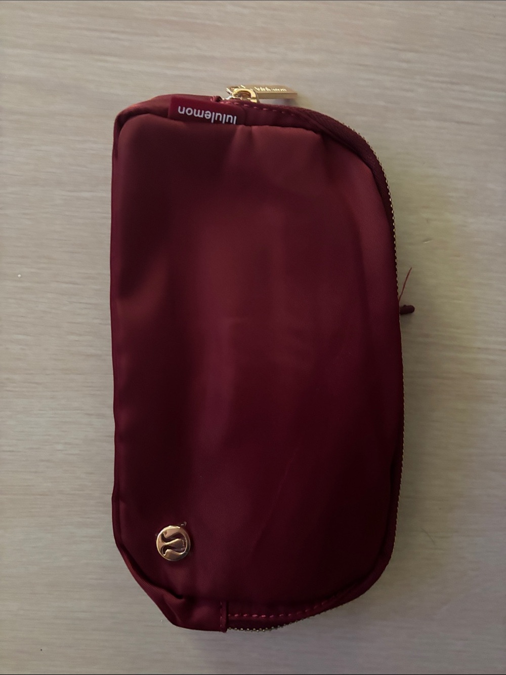 lululemon athletica Burgundy Mini Pouch with Gold Hardware